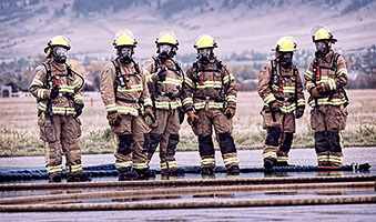 Firefighters in open lot